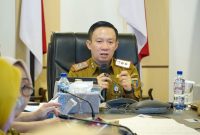 Sekretaris Daerah Provinsi Lampung Marindo Kurniawan memaparkan pemanfaatan super aplikasi Lampung-In sebagai dasar pengambilan kebijakan saat visitasi ASKOMPSI Digital Leadership Government Award 2026 di Kantor Gubernur Lampung, Selasa (21/7/2026).