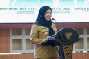 Wali Kota Bandar Lampung Eva Dwiana memberikan sambutan saat pelantikan Forum Komunikasi Alumni Ikatan Mahasiswa Muhammadiyah FOKAL IMM Kota Bandar Lampung di Aula Semergou, Selasa (21/7/2026).`