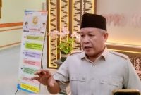 Wakil Ketua Pansus DPRD Kota Bandar Lampung Yuhadi saat memberikan keterangan terkait pembahasan temuan BPK, Selasa (14/7/2026). Ia menyebut tidak ada larangan bagi media untuk meliput. Foto: PROYEKSI.ID