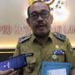  Kepala Dinas Kesehatan Kota Bandar Lampung Muhtadi Arsyad Temenggung saat memberikan keterangan usai RDP dengan Komisi IV DPRD terkait evaluasi program dan serapan anggaran. Foto: istimewa