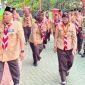 Wakil Ketua I Kwarcab Gerakan Pramuka Kota Bandar Lampung Hj. Eka Afriana, S.Pd berjalan menuju lokasi apel peringatan Hari Pramuka ke-65 di SMPN 3 Bandar Lampung, Jumat (14/8/2026). FOTO: Istimewa